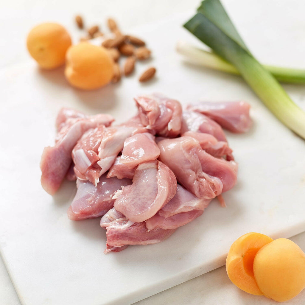 Organic diced chicken leg meat with whole and sliced apricots, almonds and whole leeks