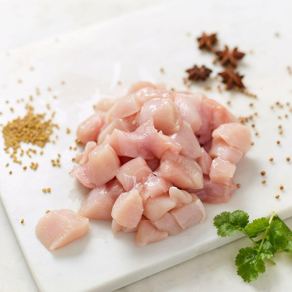 Organic diced chicken breast fillet with star anise, parsley leaves and seasonings