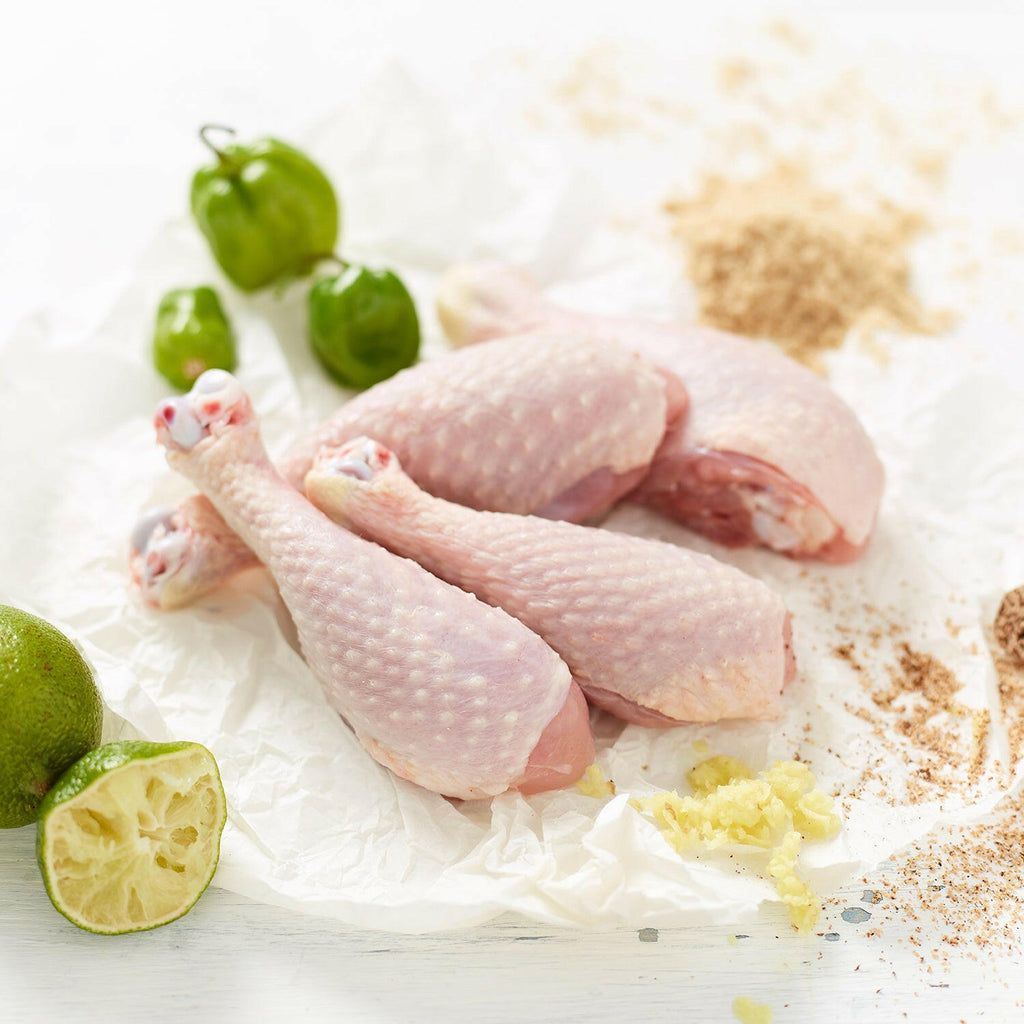 Free Range Chicken Drumsticks With Ginger, Demerara Sugar, Whole Lime, Lime Wedges and Scotch Bonnets